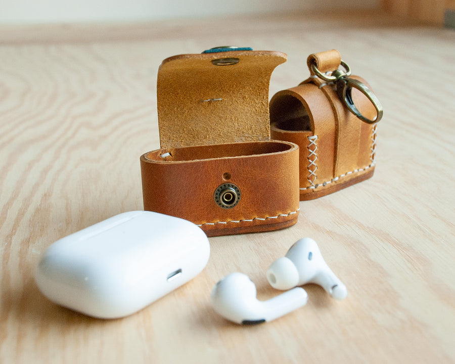 Leather AirPods case hand-stitched edge detail, TRIM