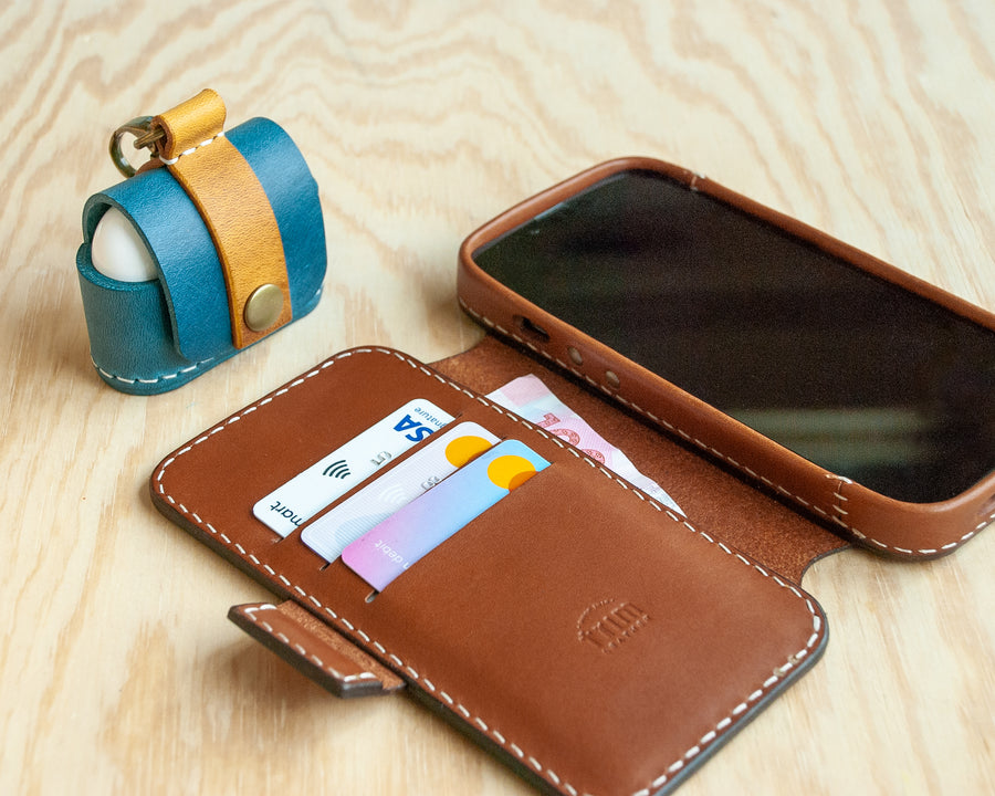 Saddle leather iPhone wallet folio open, showing card slots