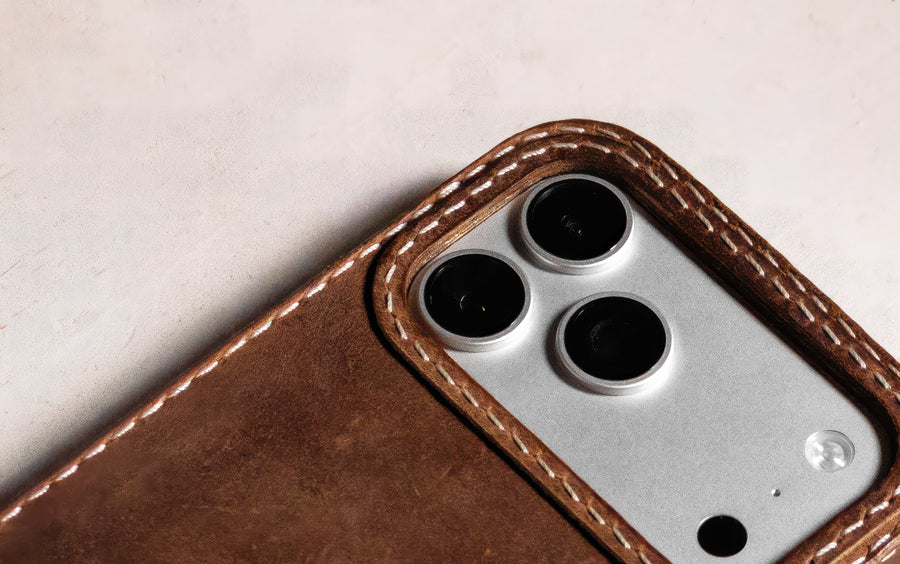 Walnut leather iPhone case camera lens cutout detail, TRIM