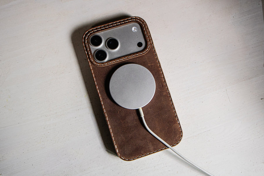 Walnut leather iPhone case back showing MagSafe alignment