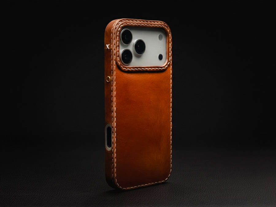 Ember leather iPhone case with MagSafe alignment, hand-stitched by TRIM
